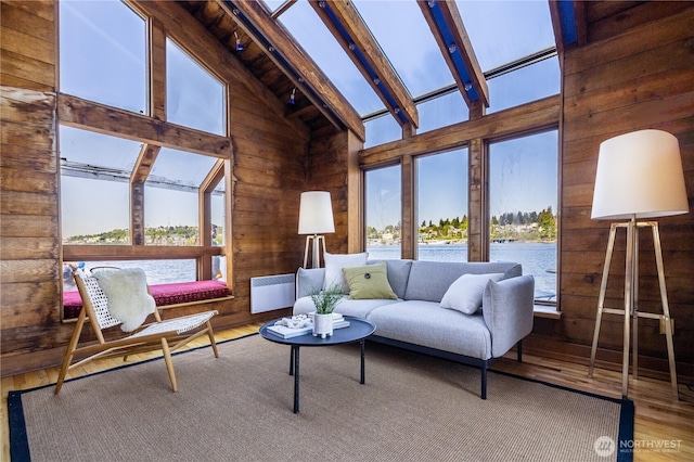 3123 Fairview Ave E Unit 2, Seattle, WA 98102 - living area with high vaulted ceiling, a water view, wood walls, and wood finished floors