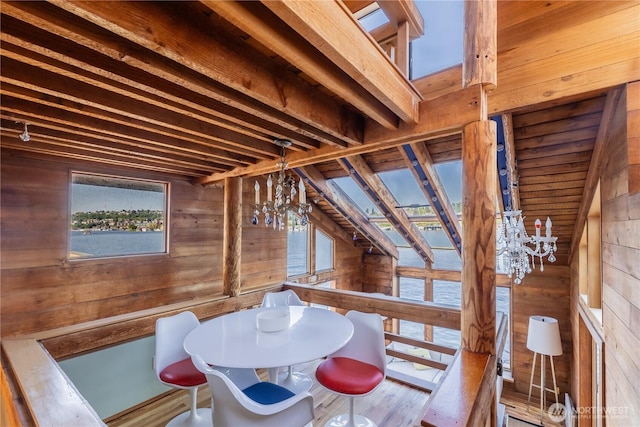 3123 Fairview Ave E Unit 2, Seattle, WA 98102 - dining area with wood walls, wood finished floors, and a notable chandelier