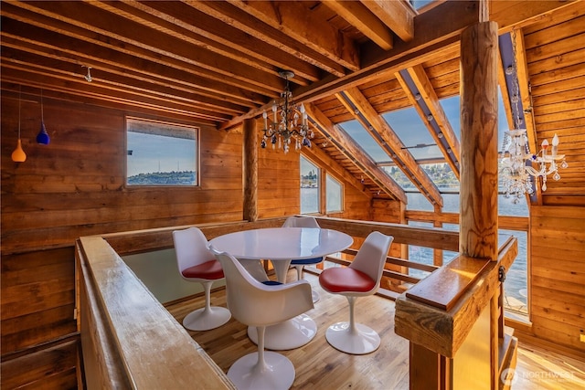 3123 Fairview Ave E Unit 2, Seattle, WA 98102 - dining area featuring wood walls, a notable chandelier, and wood finished floors