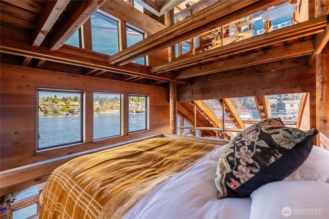 3123 Fairview Ave E Unit 2, Seattle, WA 98102 - bedroom with wooden walls, a water view, and beam ceiling
