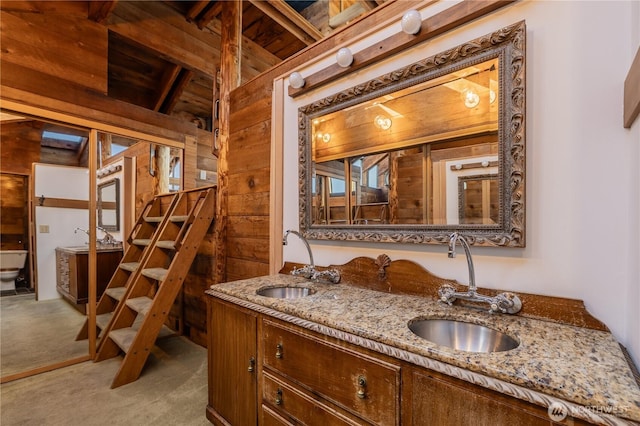 3123 Fairview Ave E Unit 2, Seattle, WA 98102 - full bathroom with double vanity, a sink, wood ceiling, and wood walls