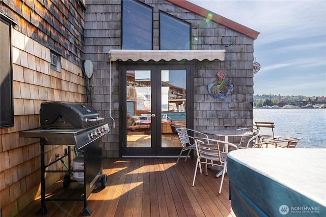 3123 Fairview Ave E Unit 2, Seattle, WA 98102 - wooden deck featuring french doors, a water view, and area for grilling