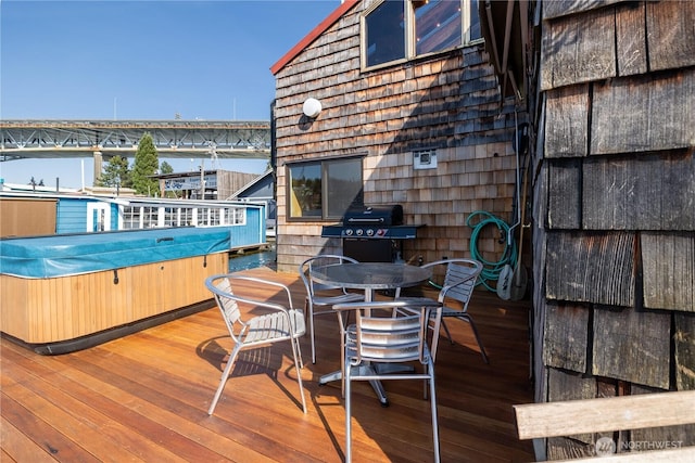 3123 Fairview Ave E Unit 2, Seattle, WA 98102 - wooden terrace with a hot tub, outdoor dining area, and area for grilling