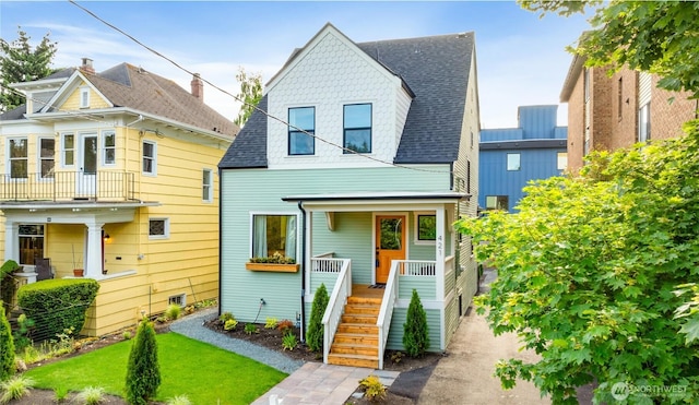 421 Malden Ave E, Seattle, WA 98112 - view of front of home with a shingled roof, covered porch, and stairs