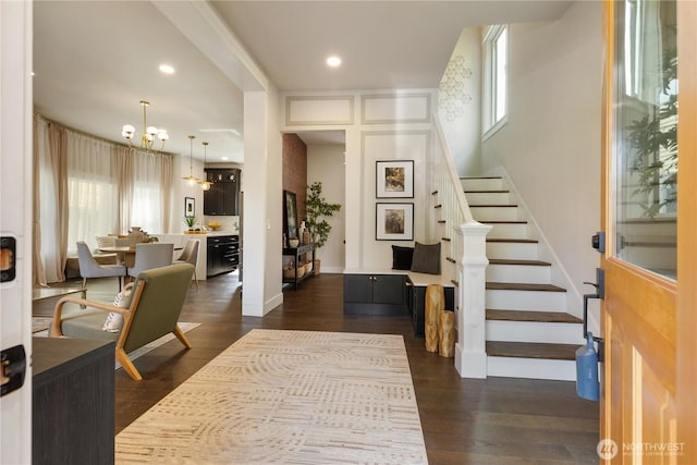421 Malden Ave E, Seattle, WA 98112 - foyer featuring a chandelier, stairway, dark wood-type flooring, baseboards, and recessed lighting
