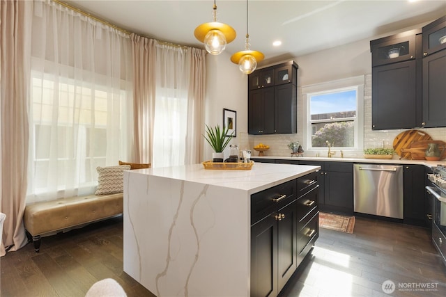 421 Malden Ave E, Seattle, WA 98112 - kitchen featuring dishwasher, dark wood-type flooring, decorative backsplash, and recessed lighting