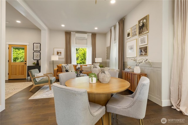 421 Malden Ave E, Seattle, WA 98112 - dining room featuring a wall unit AC, plenty of natural light, dark wood finished floors, recessed lighting, and a wainscoted wall