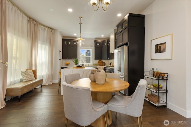 421 Malden Ave E, Seattle, WA 98112 - dining space featuring dark wood finished floors, baseboards, recessed lighting, and a chandelier