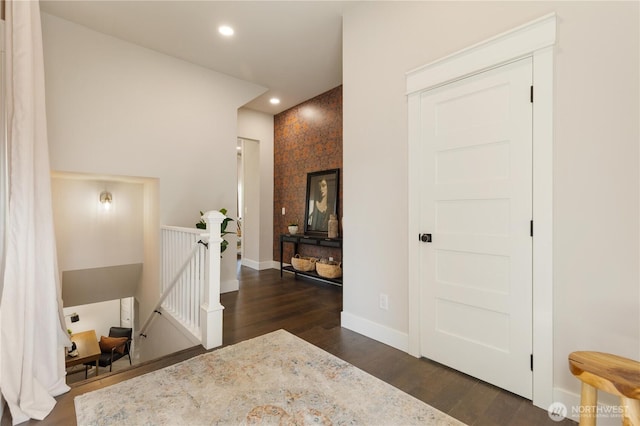 421 Malden Ave E, Seattle, WA 98112 - corridor with an upstairs landing, dark wood-style flooring, baseboards, recessed lighting, and an accent wall