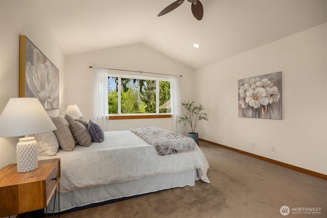 carpeted bedroom with baseboards, ceiling fan, and vaulted ceiling