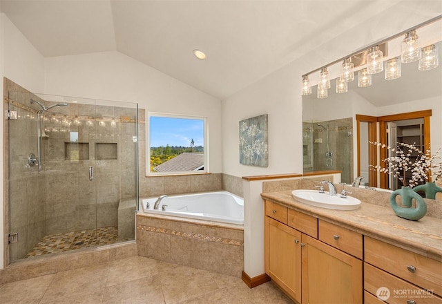 full bath featuring a garden tub, vanity, lofted ceiling, tile patterned floors, and a shower stall