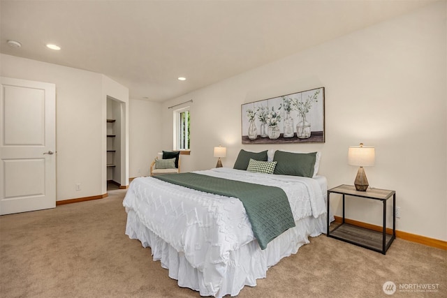 carpeted bedroom featuring baseboards and recessed lighting