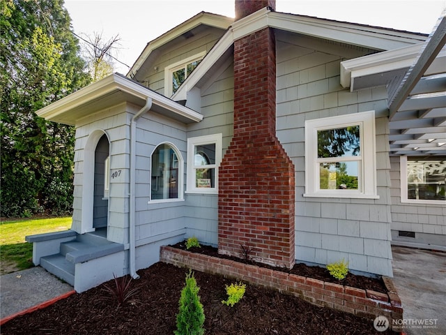 view of home's exterior with a chimney