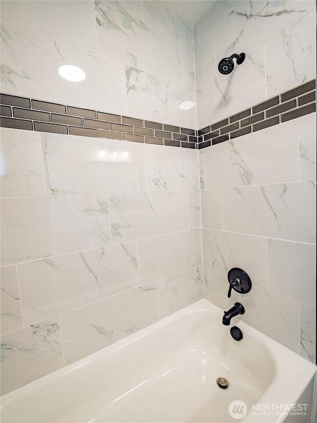 bathroom featuring shower / washtub combination