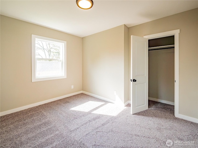 unfurnished bedroom with carpet and baseboards