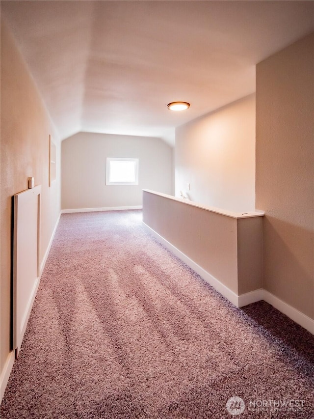 bonus room featuring baseboards, carpet floors, and lofted ceiling