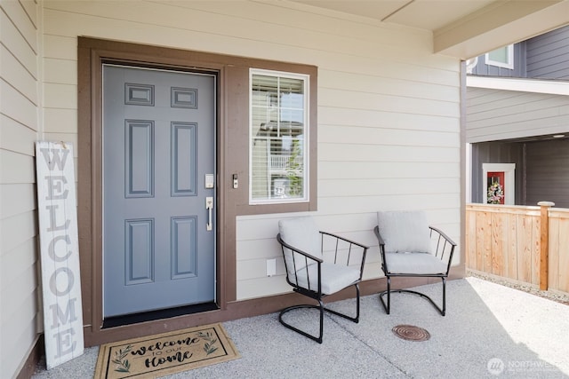 property entrance featuring covered porch