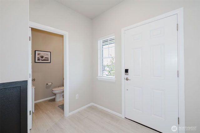 entrance foyer featuring baseboards and light wood-style flooring