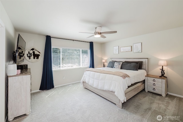 carpeted bedroom featuring baseboards and ceiling fan