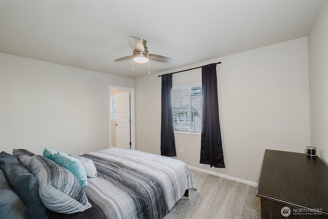 bedroom featuring a ceiling fan, baseboards, and carpet