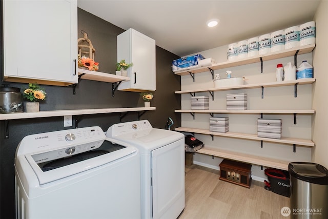 laundry room featuring cabinet space, washer and dryer, light wood-style floors, recessed lighting, and baseboards