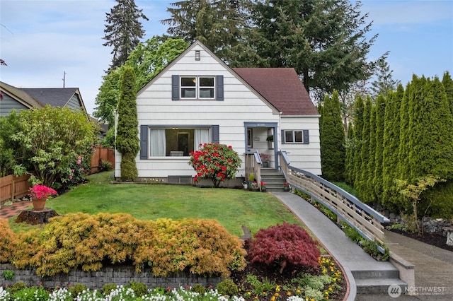 bungalow-style home featuring a shingled roof, a front lawn, and fence
