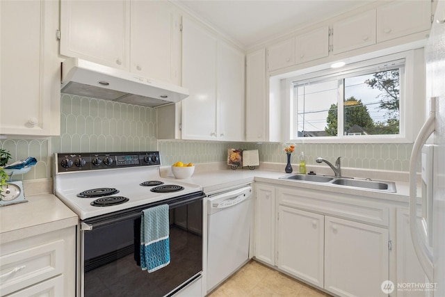 kitchen featuring range with electric stovetop, white dishwasher, light countertops, under cabinet range hood, and a sink