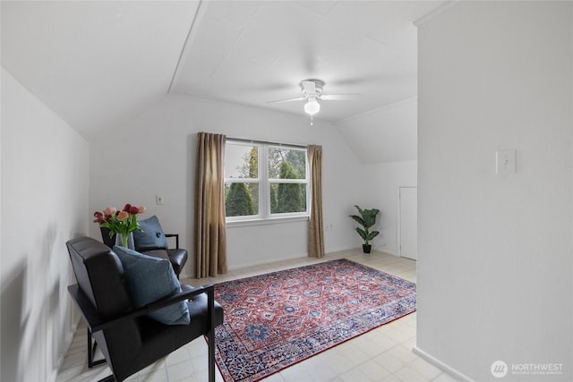 interior space featuring a ceiling fan and lofted ceiling
