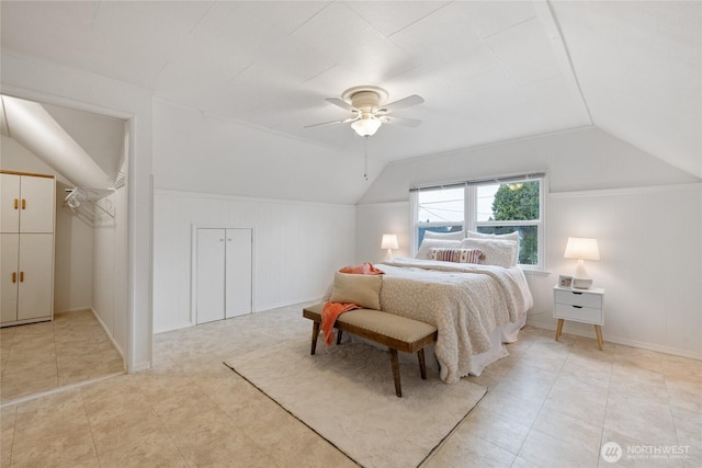 bedroom featuring a ceiling fan and lofted ceiling