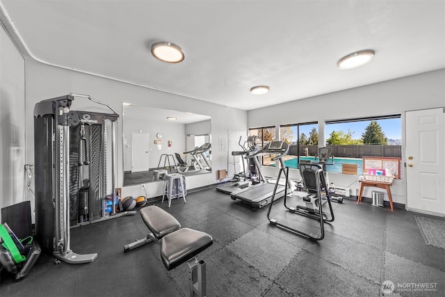gym featuring baseboards