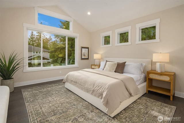 bedroom with high vaulted ceiling, dark wood finished floors, baseboards, and recessed lighting