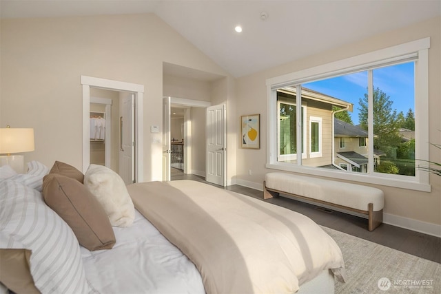 bedroom with multiple windows, baseboards, lofted ceiling, wood finished floors, and recessed lighting