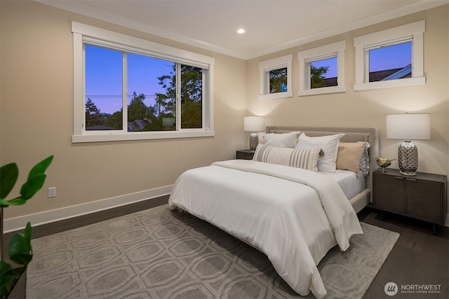 bedroom with wood finished floors, baseboards, and recessed lighting