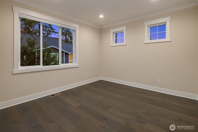 unfurnished room with baseboards, ornamental molding, dark wood-type flooring, and recessed lighting