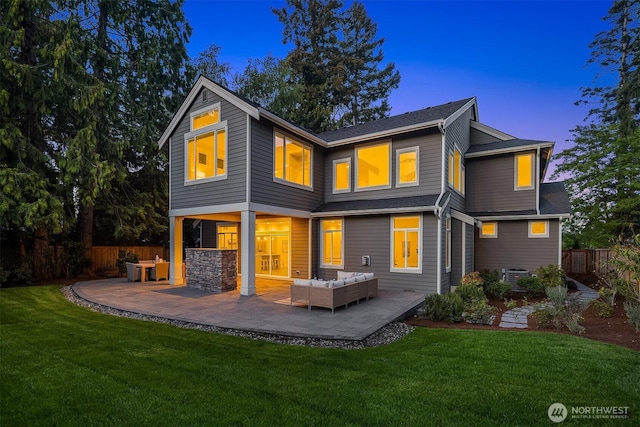 back of house at dusk with an outdoor hangout area, a patio area, and central air condition unit