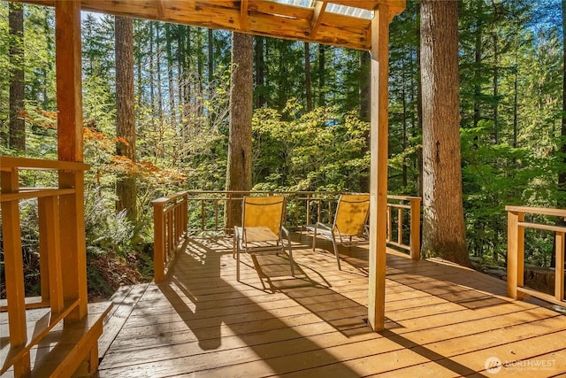 unfurnished sunroom with a view of trees
