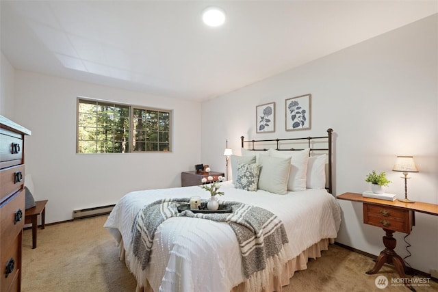 bedroom featuring baseboard heating, light carpet, and baseboards