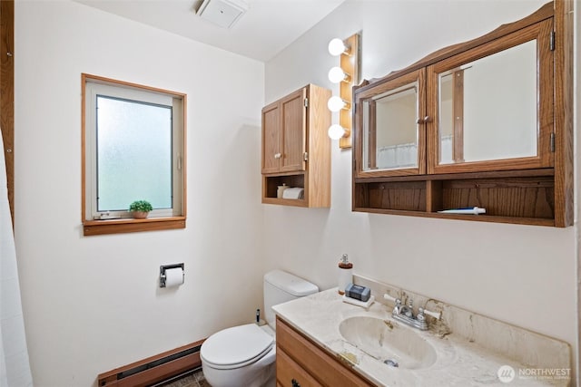 bathroom with a baseboard heating unit, toilet, and vanity