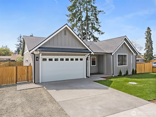 1322 114th St S, Tacoma, WA 98444 - single story home with a front yard, a shingled roof, board and batten siding, an attached garage, and driveway