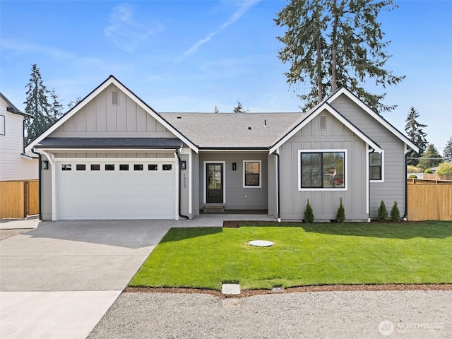 1322 114th St S, Tacoma, WA 98444 - ranch-style house featuring fence, an attached garage, a front lawn, board and batten siding, and concrete driveway
