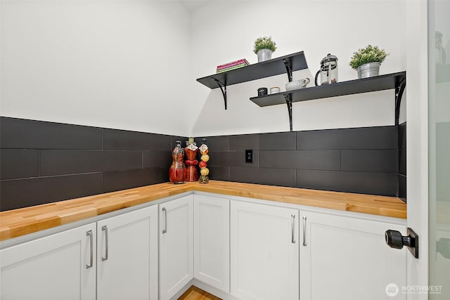 1322 114th St S, Tacoma, WA 98444 - kitchen featuring wood counters, decorative backsplash, open shelves, and white cabinetry