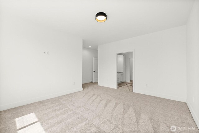 1322 114th St S, Tacoma, WA 98444 - unfurnished bedroom with light colored carpet, connected bathroom, and baseboards