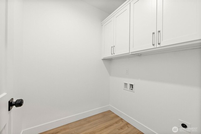 1322 114th St S, Tacoma, WA 98444 - washroom featuring cabinet space, hookup for a washing machine, baseboards, light wood-type flooring, and hookup for an electric dryer