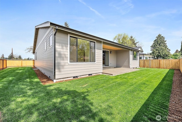 1322 114th St S, Tacoma, WA 98444 - rear view of house with a yard, a patio, and a fenced backyard