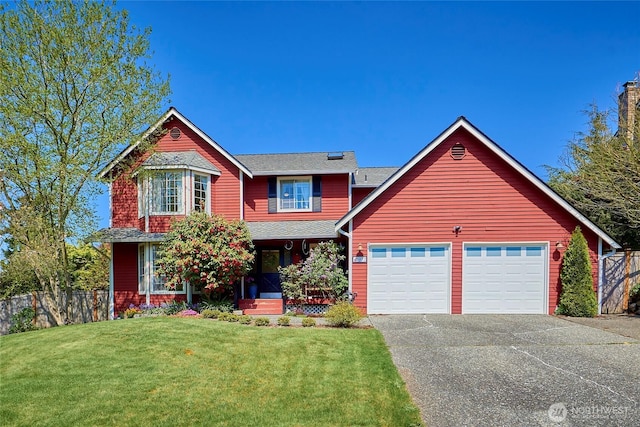 972 16th Ct, Mukilteo, WA 98275 - view of front of home with a front lawn, fence, an attached garage, and aphalt driveway
