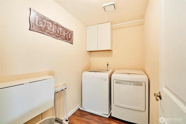 972 16th Ct, Mukilteo, WA 98275 - washroom with wood finished floors, cabinet space, and washing machine and clothes dryer