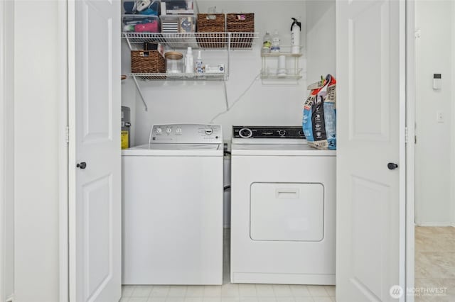 laundry area with laundry area and separate washer and dryer