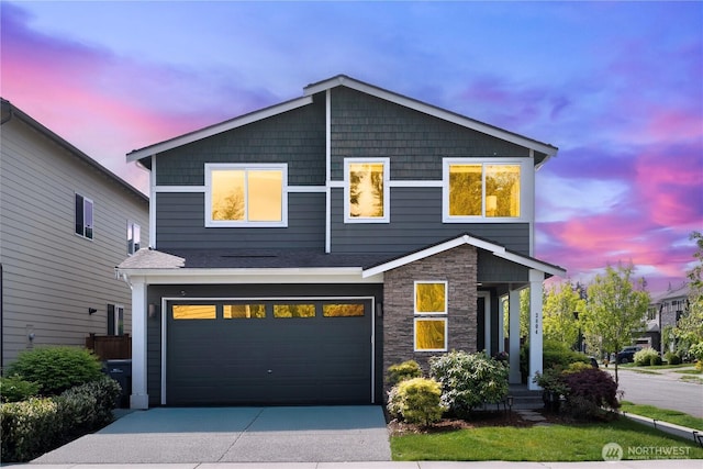 3804 193rd Pl SE, Bothell, WA 98012 - view of front facade featuring an attached garage, concrete driveway, and stone siding