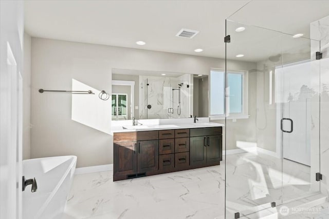 148 Henning Dr, Camano Island, WA 98282 - bathroom featuring baseboards, a marble finish shower, marble finish floors, double vanity, and recessed lighting