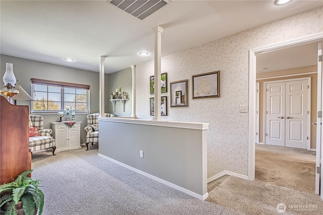 interior space featuring recessed lighting, ornate columns, visible vents, baseboards, and carpet floors